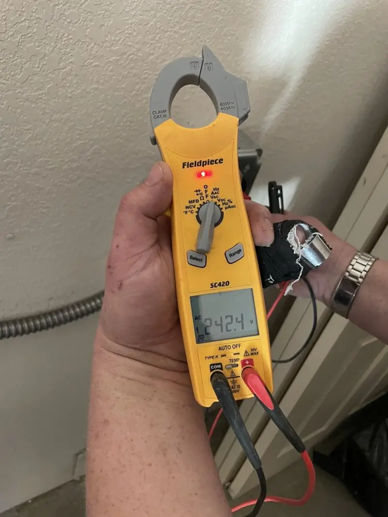 Voltage testing with clamp meter during Circuit Breaker Repair in Wilder